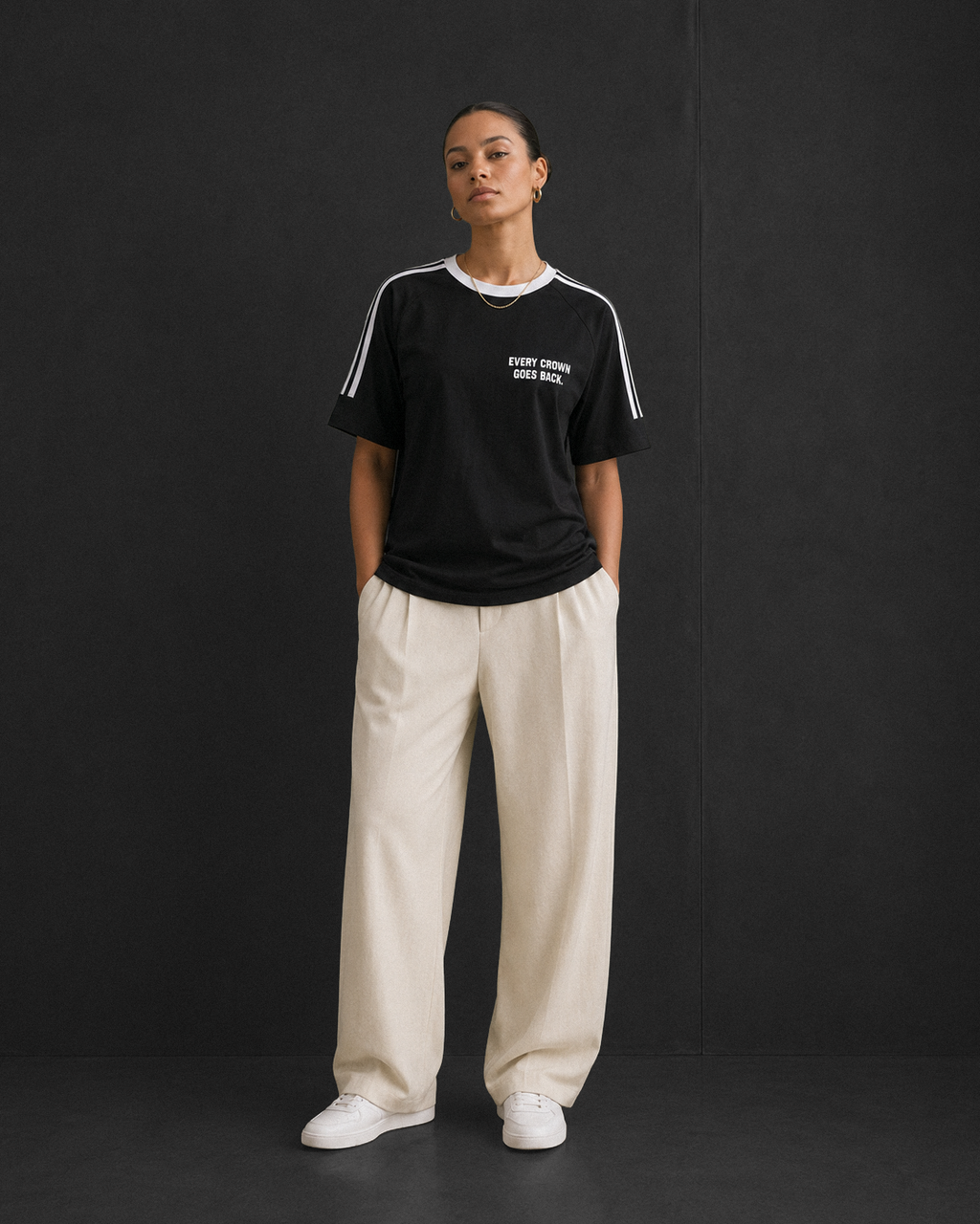 Every Crown Goes Back tee, black, studio shot of model wearing the regular-fit tee