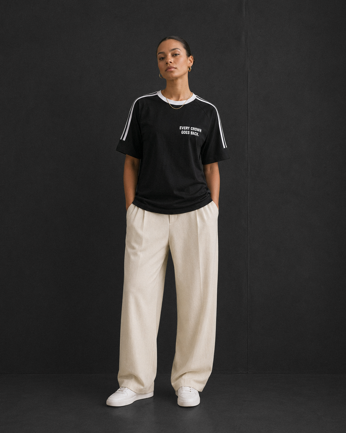Every Crown Goes Back tee, black, studio shot of model wearing the regular-fit tee