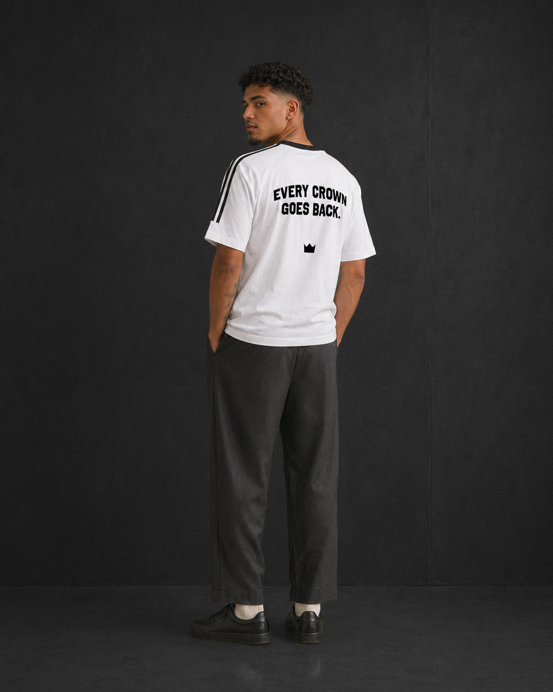 Every Crown Goes Back tee, white, studio shot of model wearing the regular-fit tee