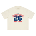 It Can Happen tee, cream, ghost product shot showing Believe 26 It Can Happen front print in red and blue, front product shot