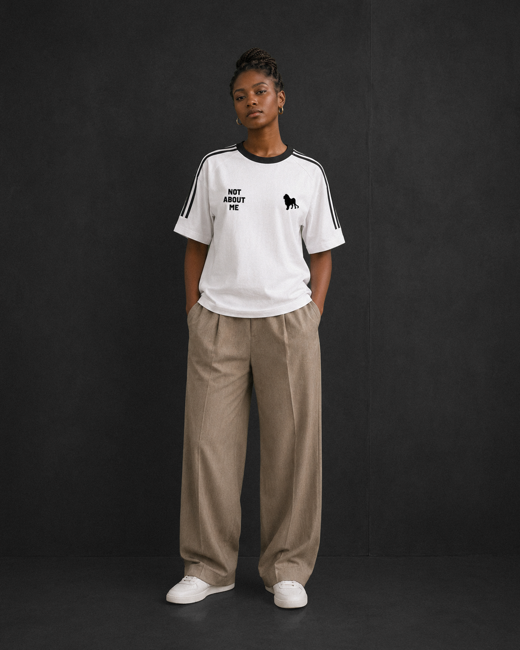Not About Me tee, white, studio shot of model wearing the regular-fit tee