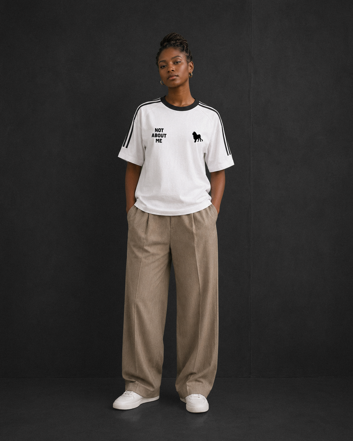 Not About Me tee, white, studio shot of model wearing the regular-fit tee